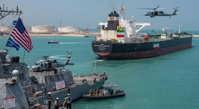 US Navy destroyer interdicting Iranian oil tanker during Gulf blockade