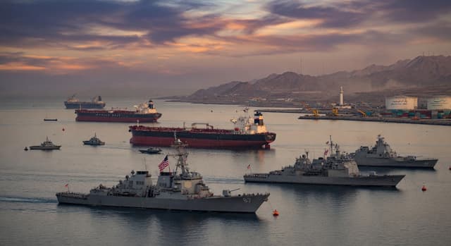 US Navy enforcing the strategic blockade in the Persian Gulf at twilight